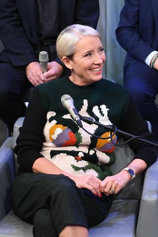 Emma Thompson wearing a statement black jumper and trousers