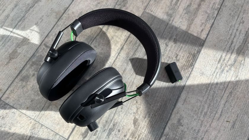 Razer Blackshark V3 wireless headset against a grey background with dongle