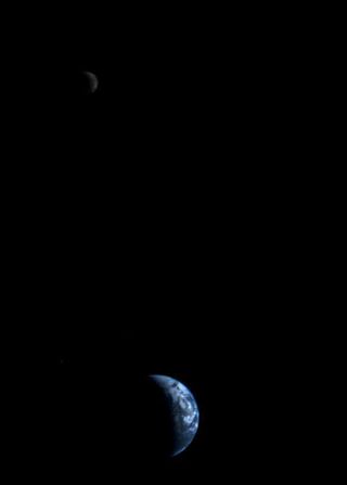 This picture of a crescent-shaped Earth and moon -- the first of its kind ever taken by a spacecraft -- was recorded Sept. 18, 1977, by NASA's Voyager 2 when it was 7.25 million miles (11.66 million kilometers) from Earth. Because the Earth is many times brighter than the moon, the moon was artificially brightened so that both bodies would show clearly in the prints.