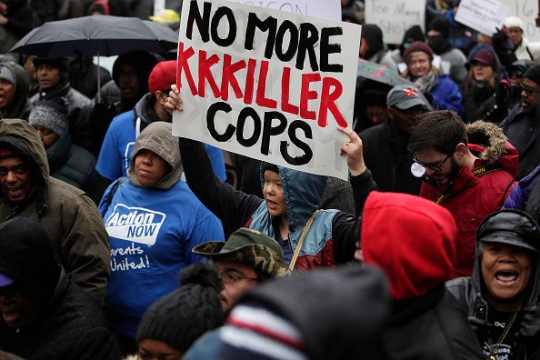 Demonstrators protest the fatal shooting of Laquan McDonald