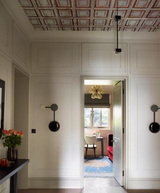 entryway with patterned ceiling