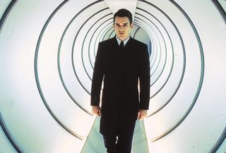 Ethan Hawke in Gattaca (1997). In a future where eugenics is rife, those whose genes have been intentionally curated form a "valid" elite, whereas "invalids" conceived by natural means exist as an underclass. Vincent Freeman (Hawke) is an invalid who, in the hope of becoming an astronaut, must assume the identity of a valid.