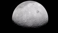 a grey, crater-marked orb on a black background