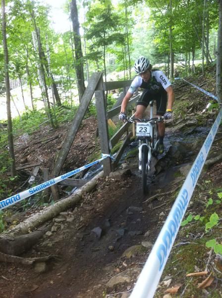 A rider on the cross country course's only stream crossing
