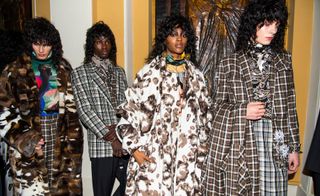 4 models in large patterned coats