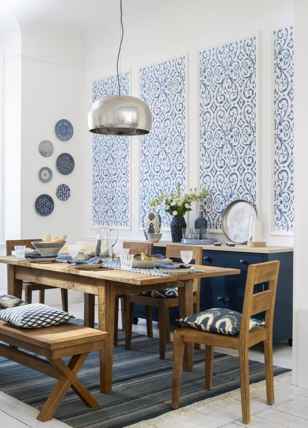 picture of blue themed dining room with wall accessories