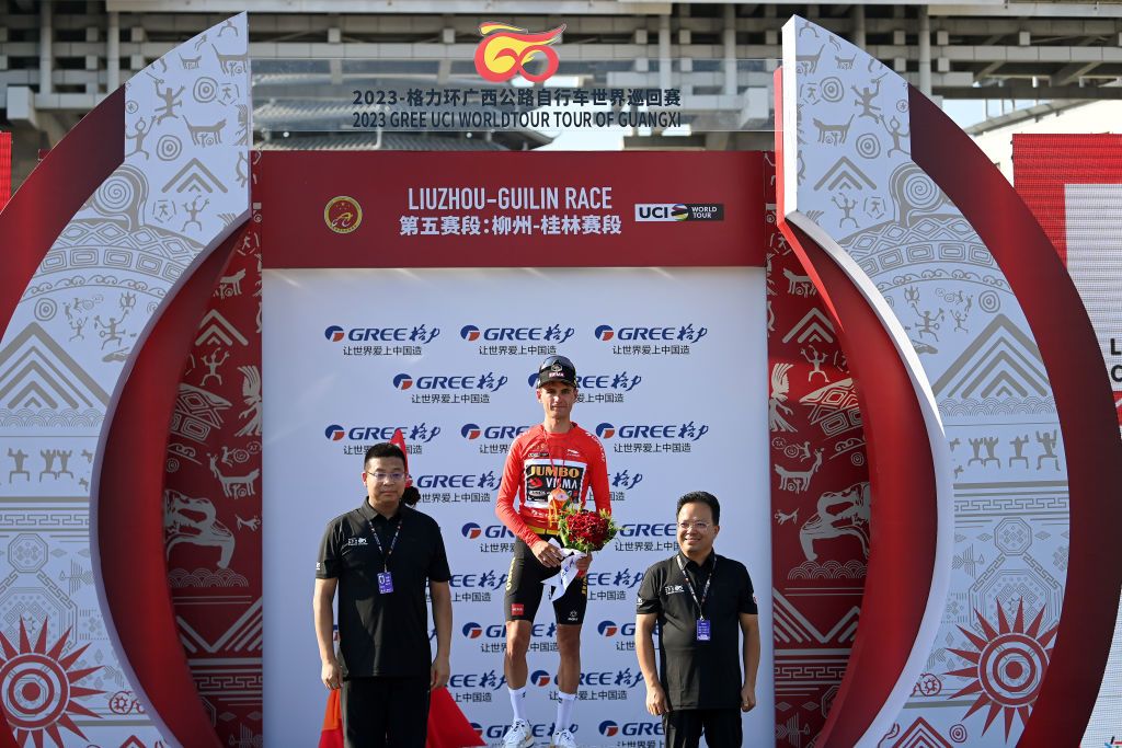 GUILIN CHINA OCTOBER 16 Milan Vader of The Netherlands and Team JumboVisma celebrates at podium as Red Leader Jersey winner during the 4th GreeTour of Guangxi 2023 Stage 5 a 2096km stage from Liuzhou to Guilin UCIWT on October 16 2023 in Guilin China Photo by Tim de WaeleGetty Images