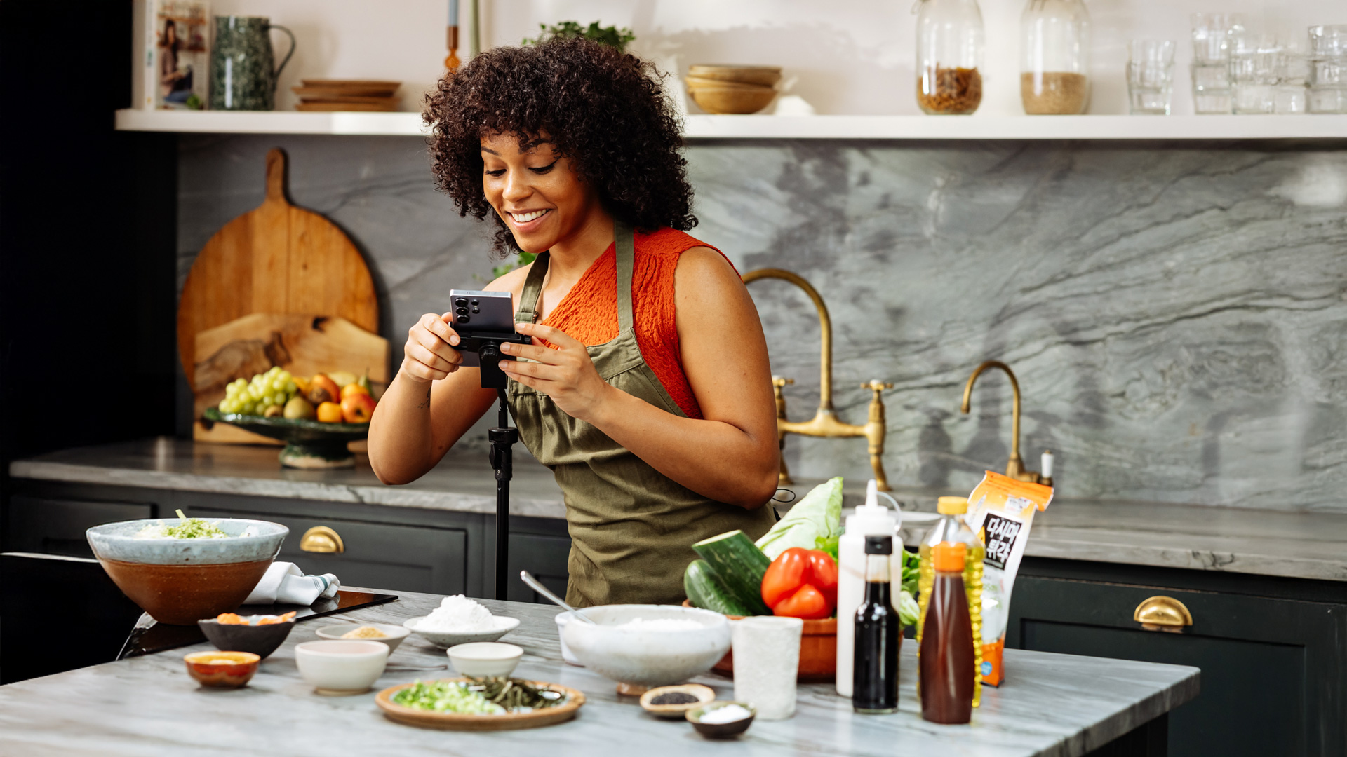 Woman uses Samsung phone to take video of food