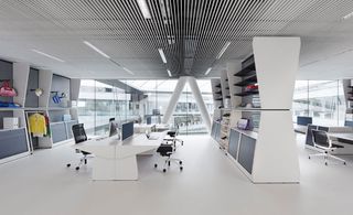 office workstations in the adidas HQ with displays of adidas products and storage