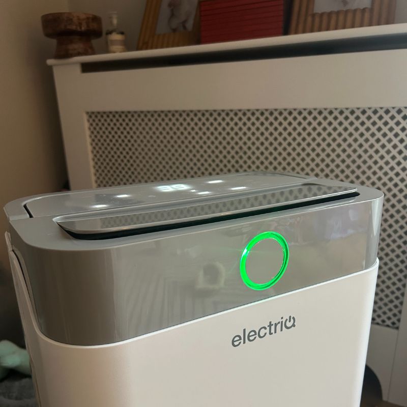 ElectricQ dehumidifier front with brand logo, green ring light