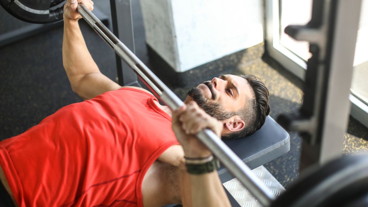 A man performing bench press