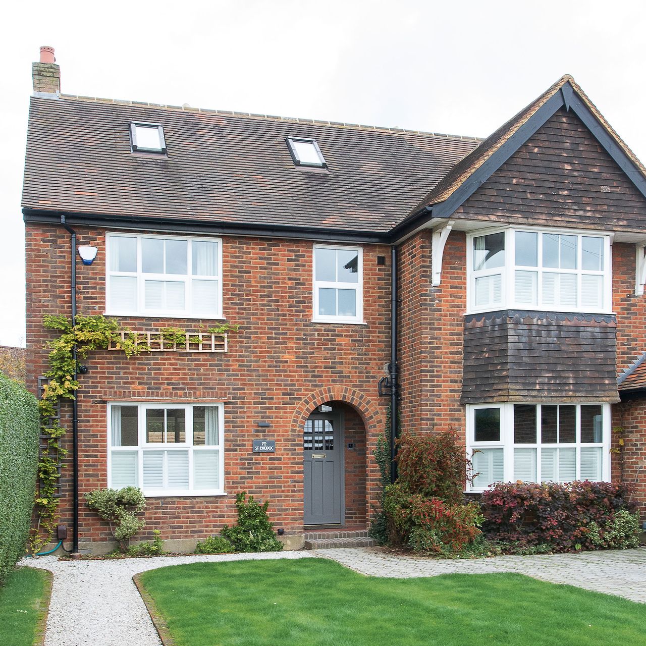 Red brick exterior with lawn