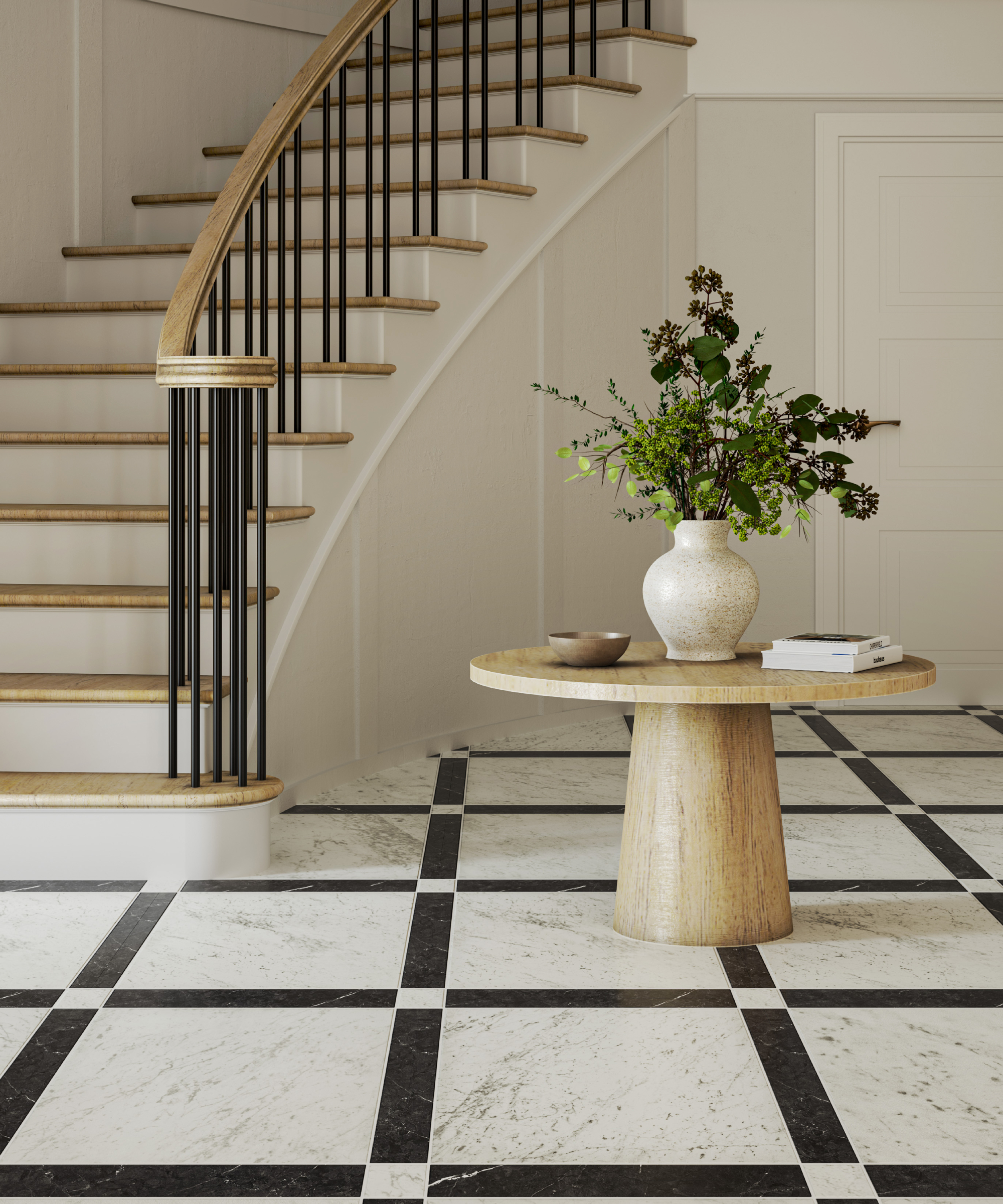 large hallway with large cream marble effect floor tiles with black border, round wooden table in centre leading to large curved staircase