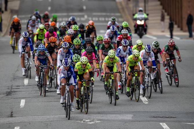 The field bunches up before another attack goes up the road.
