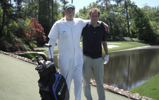 David Taylor and his caddie on the 12th at Augusta National
