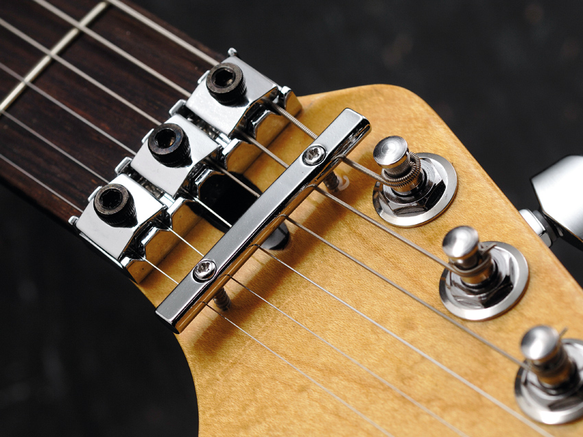 Something about a double-locking vibrato on a silver Strat just works…