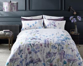 Purple floral duvet in bedroom by The French Bedroom Company