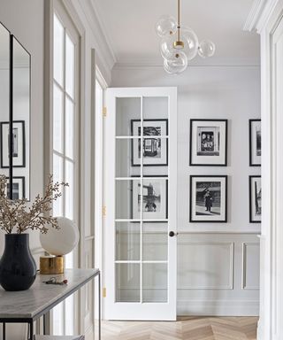 white hallway with black and white photography