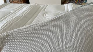 The grippy underside of the OTTY Memory Foam Mattress Topper