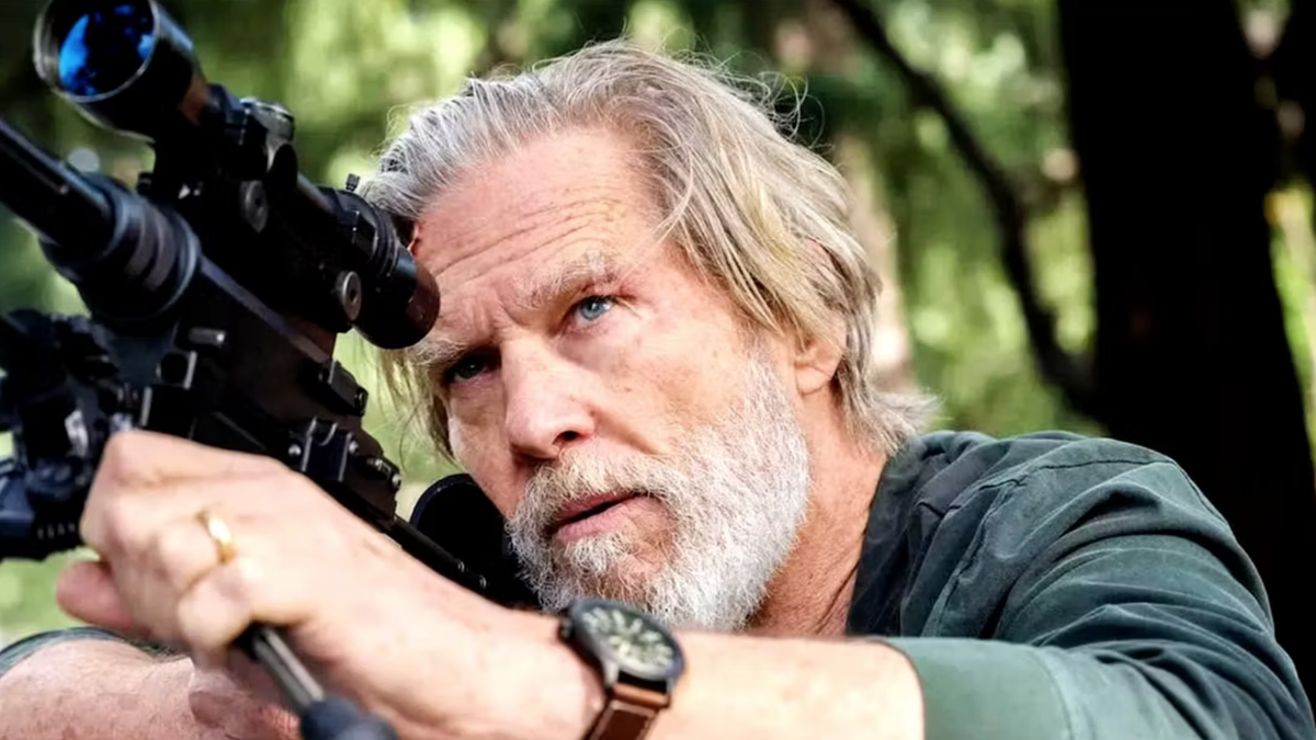 Dan Chase, the former C.I.A guy who just can&#039;t quit, played by a bearded Jeff Bridges, looks through a sniper gunsight in a scene from &quot;The Old Man&quot; season 2