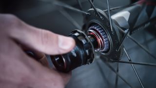 a MTB wheel freehub being fitted to a wheel