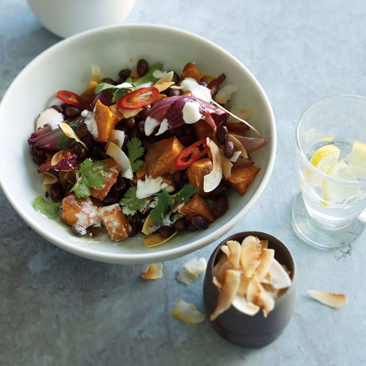 Black bean, chorizo, sweet potato and coconut bowl photo