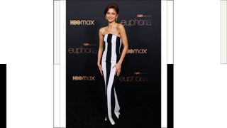 Zendaya wears a black and white striped dress as she attends HBO's "Euphoria" Season 2 Photo Call at Goya Studios on January 05, 2022 in Los Angeles, California.