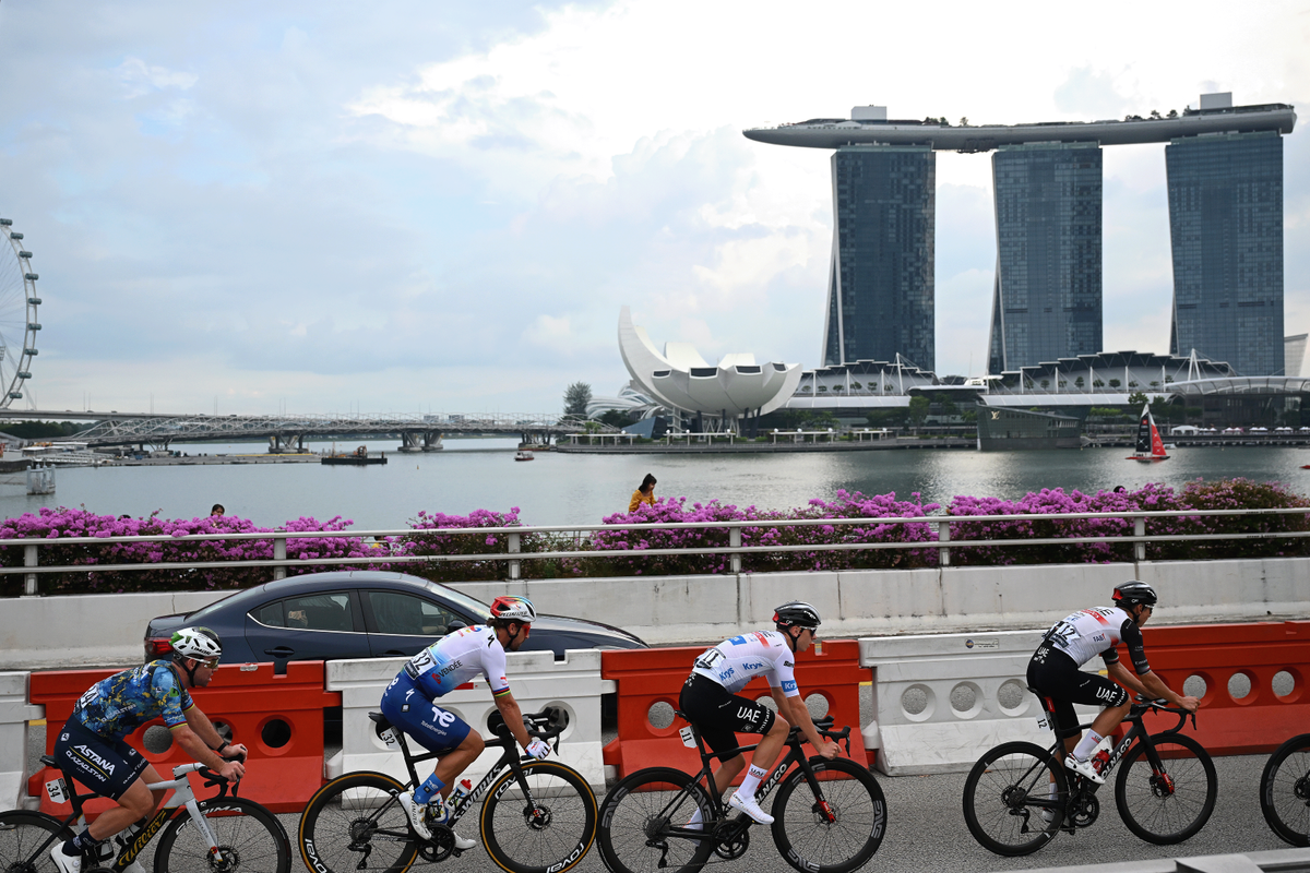Riders complete the Tour de France Singapore Criterium with the Marina Bay Sands hotel in the background