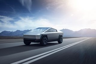 Tesla Cybertruck speeds throug the desert