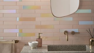 Bathroom tiles in a mix of lilac, pale pink and opal shades with a holographic qualities