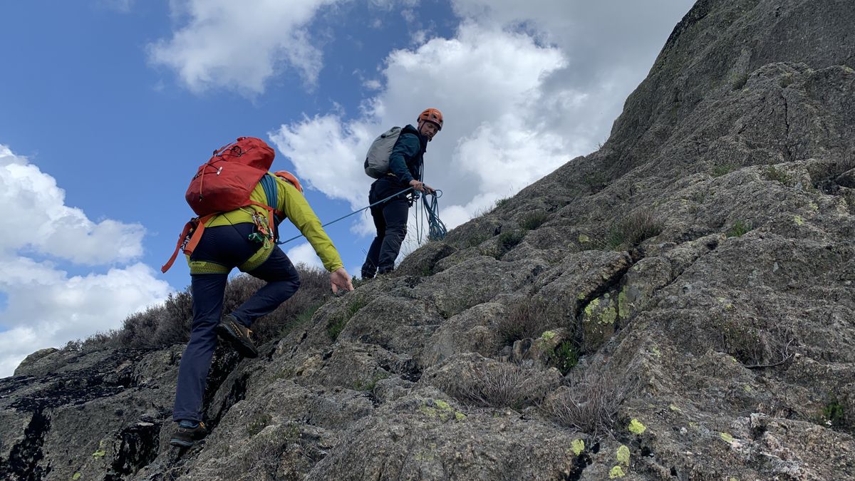 Two men doing roped scrambling