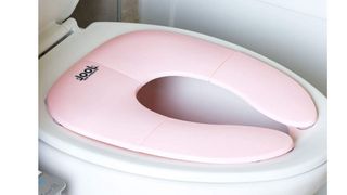 Pink fold up toilet seat