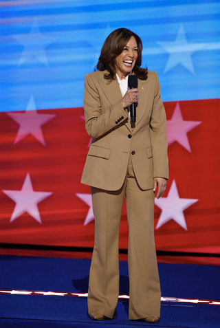 Democratic presidential candidate, U.S. Vice President Kamala Harris speaks onstage during the first day of the Democratic National Convention at the United Center on August 19, 2024 in Chicago, Illinois. She wore a tan suit from Chloé and pearls.