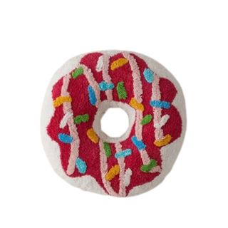 A donut shaped and decorated cushion