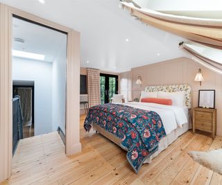 loft conversion bedroom with door leading to staircase and french doors in bedroom