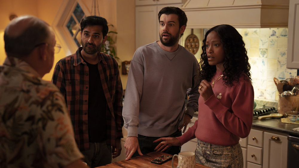 L-R: Naveen (Kapil Talwakar), Rob (Jack Whitehall), and Samira (Keke Palmer) stand in a kitchen in a scene from Peacock's &amp;quot;The Burbs&amp;quot;