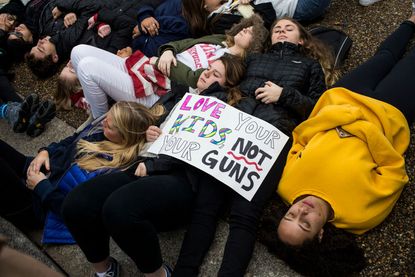 Teens hold a "lie in" at the White House Monday.