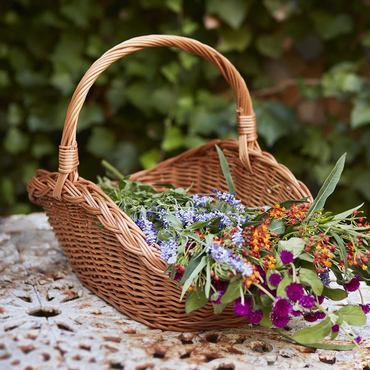 Wicker basket with picked flowers