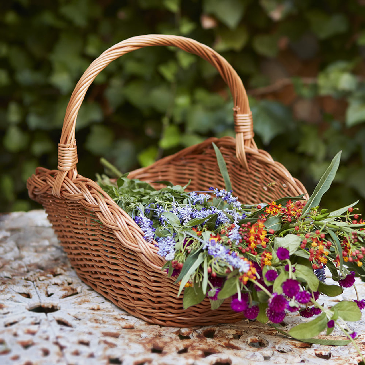 Wicker basket with picked flowers