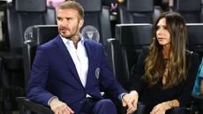  Co-owner David Beckham of Inter Miami CF and wife Victoria Beckham - who is wearing a black blazer and trouser outfit - look on prior to a game between Charlotte FC and Inter Miami at DRV PNK Stadium on October 18, 2023 in Fort Lauderdale, Florida. 