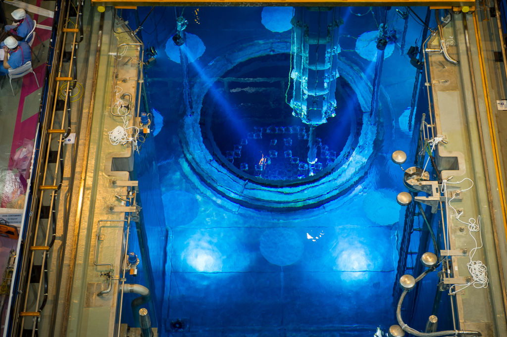 A picture shows the switched off Unit 1 nuclear reactor core, containing the combustible uranium at the bottom of the pool in the nuclear power plant of Civaux, central France, on April 25, 2016, during a control visit. Spent nuclear fuel rods are stored at the bottom of the 20-metre-deep pool, inside the building housing the Unit 1 reactor.