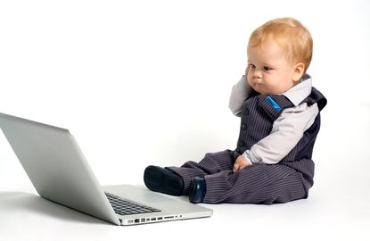 A baby with a laptop.
