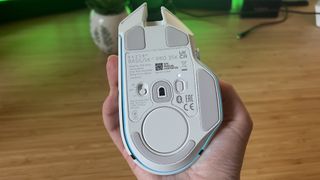 Underside of Razer Basilisk V3 Pro 35K gaming mouse showing sensor and connection toggle