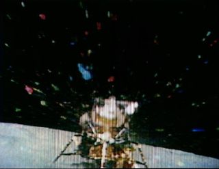 The flame from the Apollo 16 Lunar Module Orion ascent stage engine creates a kaleidoscopic effect during lunar liftoff, as seen in this color television transmission on April 23, 1972.