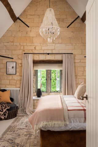 Country-style bedroom with exposed brick walls