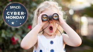 Little girl using one of the best binoculars for kids with cyber monday deal logo