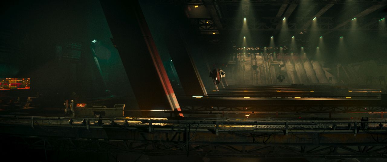 Babiru DaVinci Resolve tips; A visually striking futuristic scene captures a narrow industrial space with dramatic lighting, where a lone figure is suspended in mid-air, suggesting a moment of heightened tension or movement.