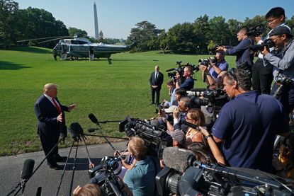 Reporters covering Trump at the White House.