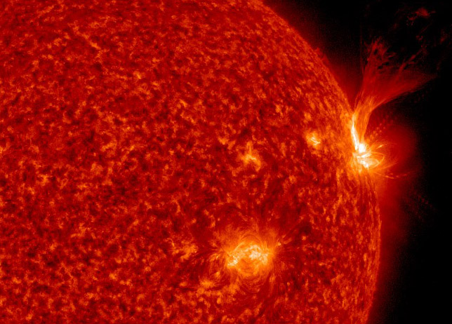 A powerful M5.8 solar flare erupts from an active sunspot region on the sun (far right) in this close-up from an image captured by NASA&#039;s Solar Dynamics Observatory on April 3, 2017.