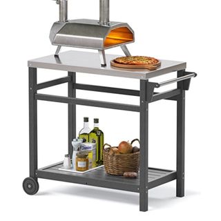 Metal pizza oven stand with pizza oven on top